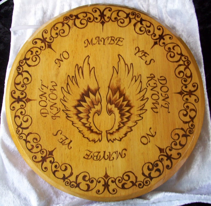 This board features a central angel wings design with an ornate design 